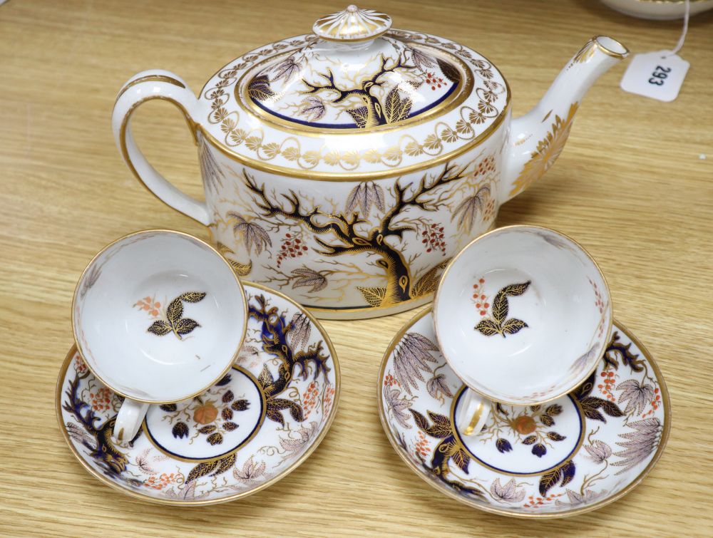 An early 19th century Newhall porcelain oval part tea set, gilt and painted in iron red and underglaze blue in the chinoiserie style